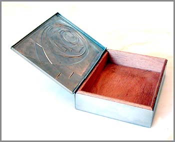 elegant modernist repoussé metal cigarette box with pressed detail, lined in cedar